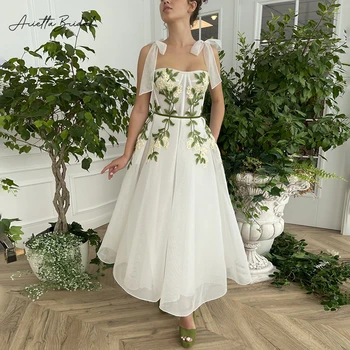 Arietta שנהב רשת רשת טול מידי שמלות לנשף סטרפלס קשת רצועות Appliqued תה אורך קו מסיבת חתונה שמלות עם כיסים